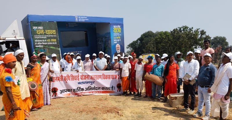 Mobile outreach van with an open display panel in a rural settlement